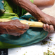 Waddugea Nirmal shaves off quills from the cinnamon plant at the Nirmal Cinnamon Farm in Galle, Sri Lanka.